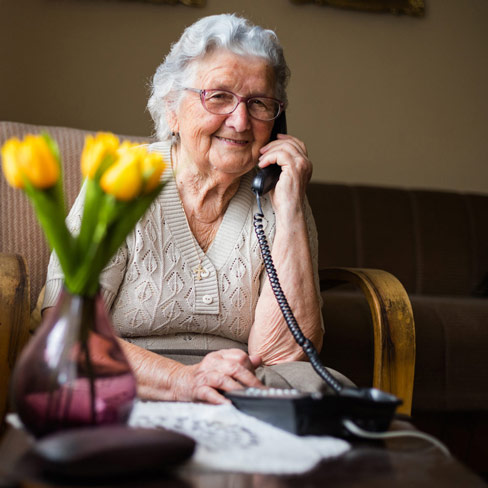 elderly lady using the phone